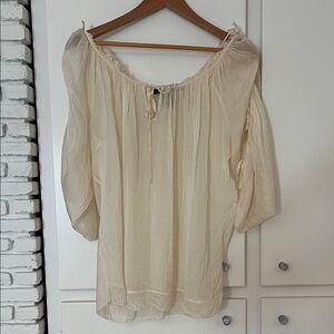 Marc Jacob’s. Ivory 100% Silk top. Adjustable neck line and sleeves.Size Small.